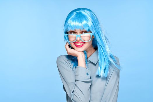 beautiful woman in blue wig glasses fashion glamor. High quality photo