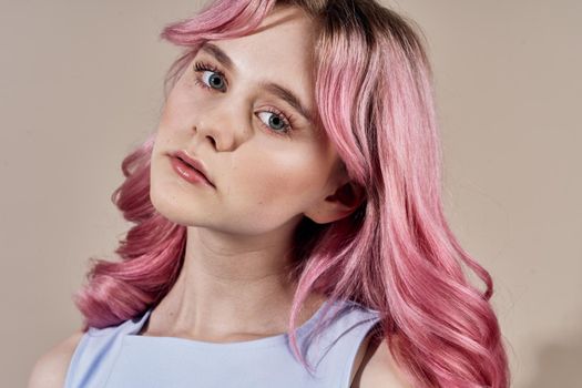 pretty cheerful woman with pink hair bright makeup posing. High quality photo