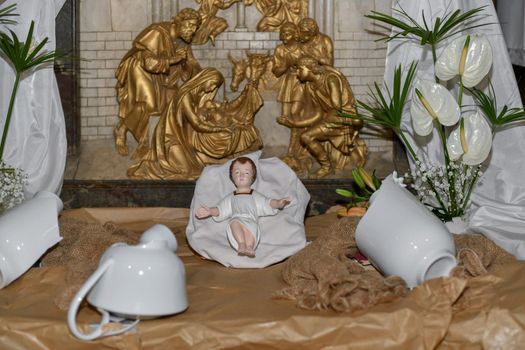 Baby Jesus laying in a cradle