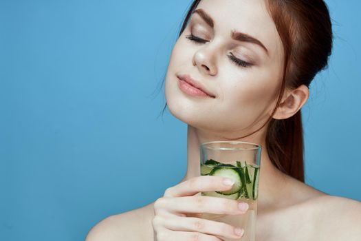 pretty woman with cucumber drink health vitamins. High quality photo