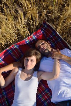 happy young couple in love have romance and fun at wheat field in summer