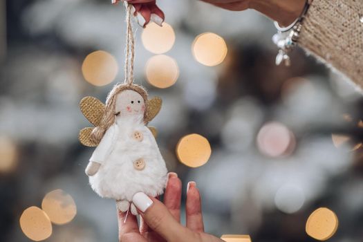 Close up of lady with white New Year toy. New Year eve concept