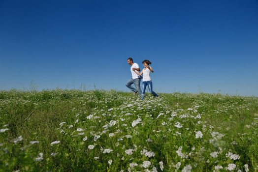 happy young couple in love have romance and fun at wheat field in summer