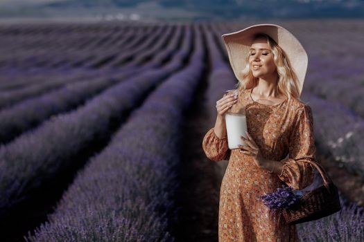 Fashion portrait of a pretty young woman in lavender field. High quality photo