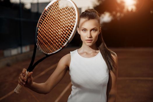 Young beautiful woman tennis player with racket. High quality photo