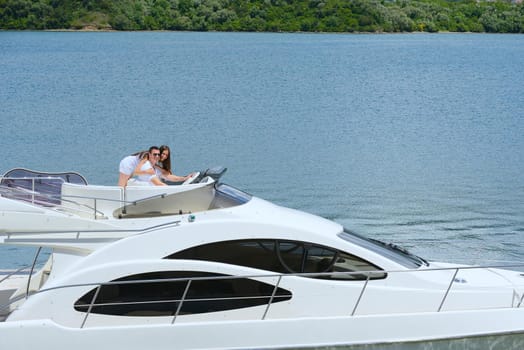 Romantic young couple spending time together and relaxing on yacht