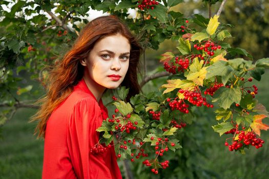 cheerful woman eating berries outdoors fresh air. High quality photo