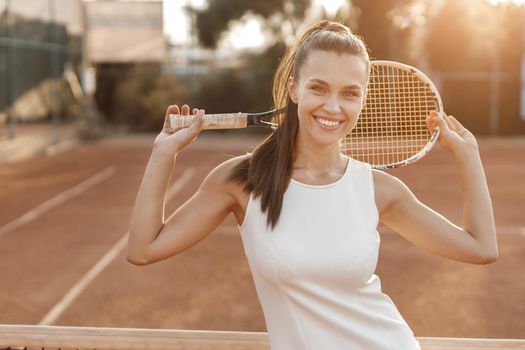 Young beautiful woman tennis player with racket. High quality photo