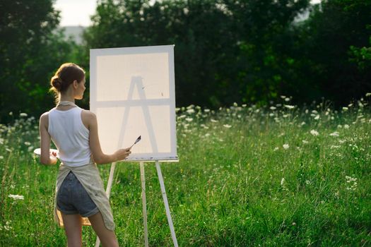 woman artist nature drawing art creative picnic. High quality photo