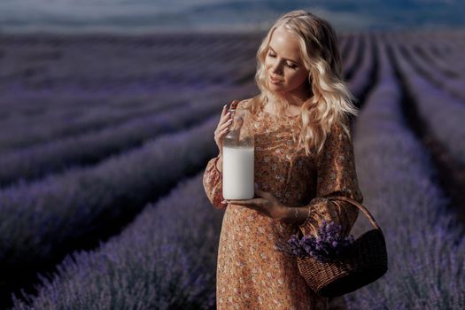 Fashion portrait of a pretty young woman in lavender field. High quality photo