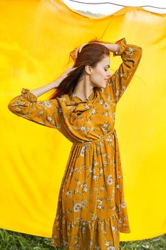 attractive woman outdoors hairstyle summer posing yellow background. High quality photo