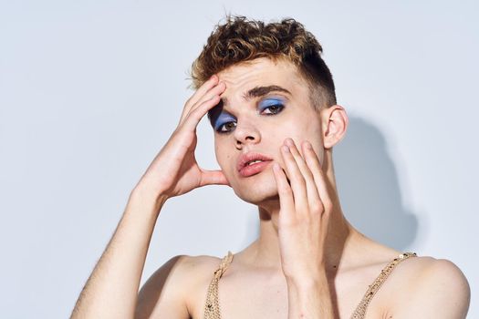 man with female makeup transgender posing fashion lgbt community. High quality photo