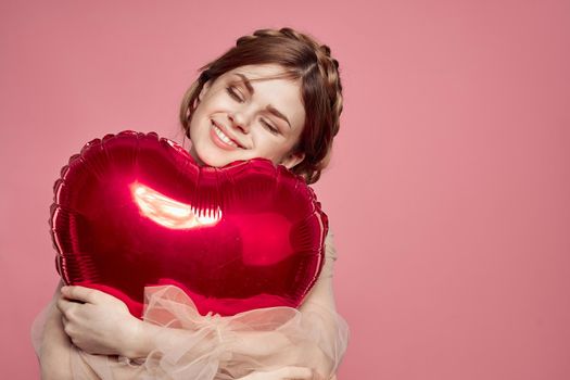 portrait of a woman in a dress balloon Valentine's Day isolated background. High quality photo