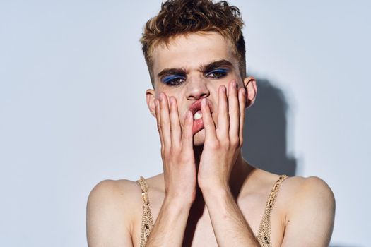 man with female makeup transgender posing fashion lgbt community. High quality photo