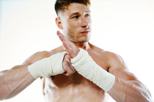 muscular man with bandaged arms gym boxer. High quality photo