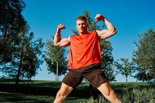 man in the park outdoors exercise workout motivation. High quality photo