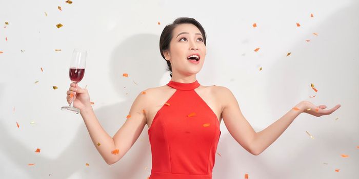 Indoor photo of pretty lady with short hair having fun at new year party with pleased face expression.