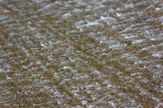 Natural dam water running diagonally down rough flat surface, South Africa