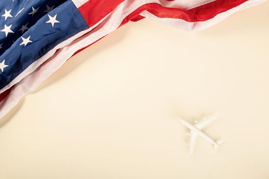Tourism Day, Model plane and flag of the USA, American flag and toy airplane, Trip travel vacation flight visa to USA is opened after coronavirus