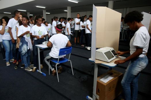 salvador, bahia, brazil - july 31, 2018: young people from a public school in the city of Salvador test an electronic ballot box used in elections in Brazil.