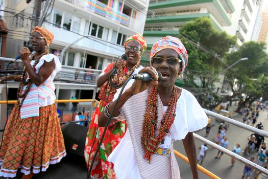 salvador, bahia, brazil - february 24, 2017: women from the cultural group As Ganhadeiras de Itapua are seen during a performance on the Carnival circuit in the city of Salvador.