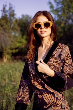 fashionable woman in sunglasses outdoors summer glamor. High quality photo