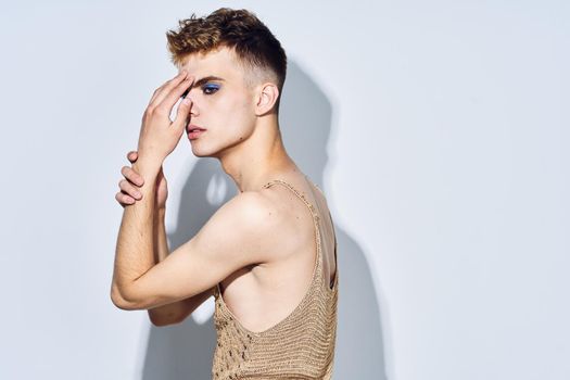 man with female makeup transgender posing fashion lgbt community. High quality photo