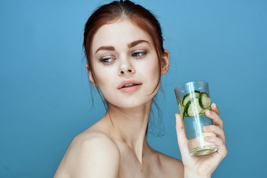 pretty woman with cucumber drink health vitamins. High quality photo