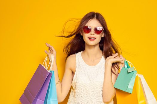 glamorous woman with packages in hands Shopaholic isolated background. High quality photo