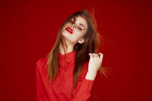 woman in red shirt posing fashion red lips fun. High quality photo