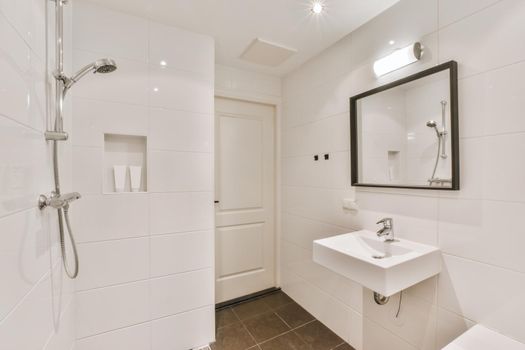 Luxurious bathroom with a large mirror in a black frame