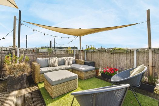 Luxurious and stylish courtyard with a garden umbrella and lots of furniture