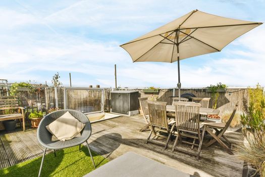 Luxurious and stylish courtyard with a garden umbrella and lots of furniture