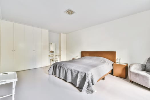 Luxurious bedroom with soft bed and fluffy bedspread