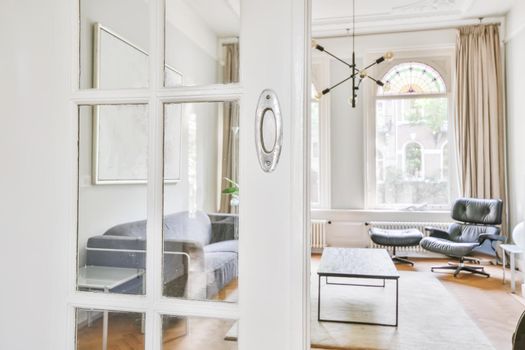 Semi-open door leading to a cozy living room