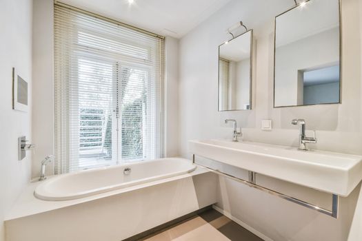 Beautiful bathroom with a large bathtub near the window