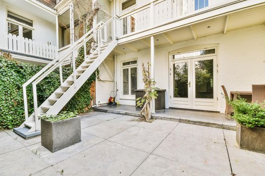 Delightfully beautiful courtyard with greenery and clearly laid cobblestones
