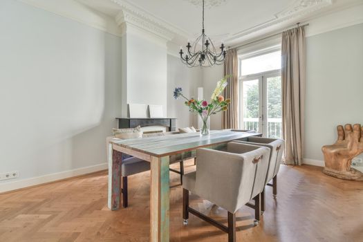 Elegant dining room with large table and comfortable soft chairs
