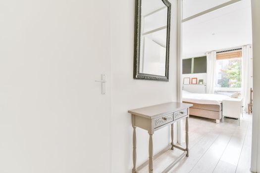 Interior of contemporary flat in minimal style with spacious hallway with white walls