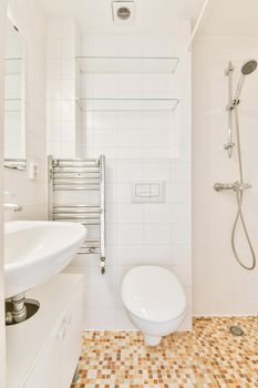 Interior of contemporary bathroom with shower and sink in minimal style in flat