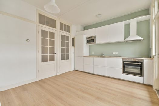 Interior of empty home kitchen with contemporary appliances