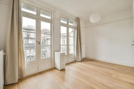 Modern room with wooden floor and white walls