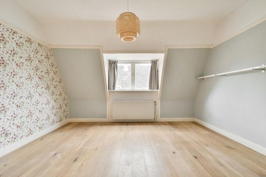 Modern room with wooden floor and white walls