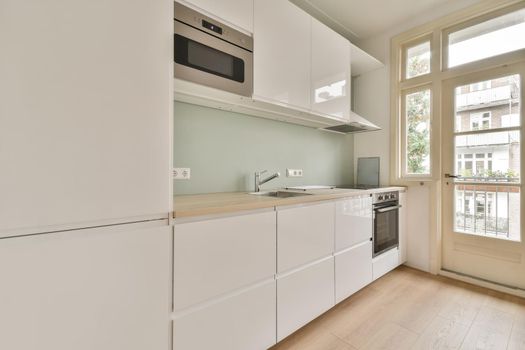 Interior of empty home kitchen with contemporary appliances