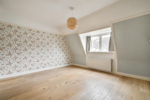 Modern room with wooden floor and white walls