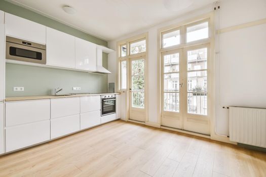 Interior of empty home kitchen with contemporary appliances