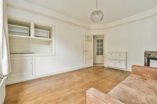 Modern room with wooden floor and white walls