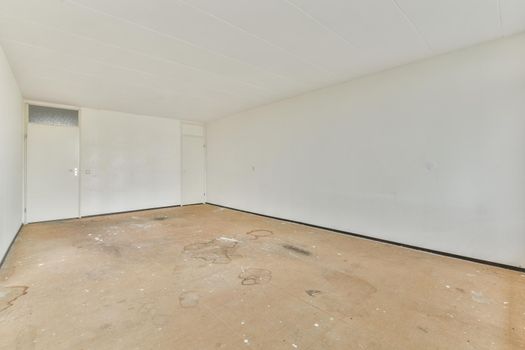 Modern room with wooden floor and white walls