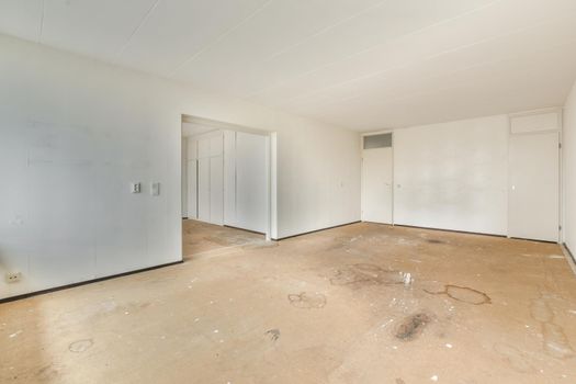 Modern room with wooden floor and white walls
