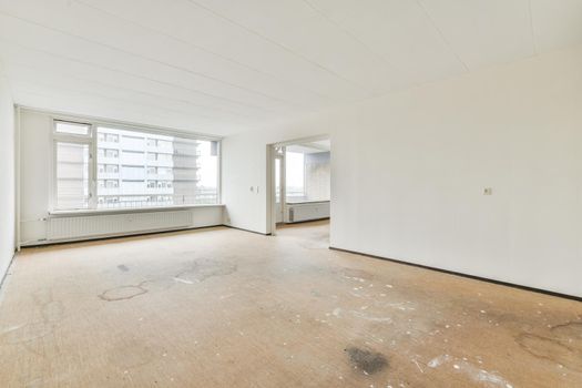Modern room with wooden floor and white walls